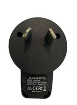 A close-up of a black AC/DC adapter plug with two prongs, resembling the 5V USB Adaptor Plug for Deluxe Electric Dog Fence by Pet Control HQ. The label reads model L30NS100, with an input of 100V-240V and an output of 5V=1000mA, and includes certification marks. Made in China.